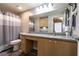 Bathroom features an extended granite countertop vanity, cabinets and vanity lighting at 6955 N Durango Dr # 2081, Las Vegas, NV 89149