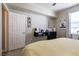 Bright bedroom with natural lighting and a black floating desk at 6955 N Durango Dr # 2081, Las Vegas, NV 89149