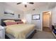 Serene bedroom with neutral colors, plush carpeting, ceiling fan, and natural light at 6955 N Durango Dr # 2081, Las Vegas, NV 89149
