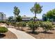 Inviting clubhouse exterior with manicured landscaping and a welcoming walkway at 6955 N Durango Dr # 2081, Las Vegas, NV 89149
