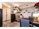 Bright dining area featuring stylish furnishings and decorative plants at 6955 N Durango Dr # 2081, Las Vegas, NV 89149