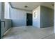 A welcoming unit entrance features a secure door and bright overhead lighting for easy access at 6955 N Durango Dr # 2081, Las Vegas, NV 89149
