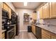 Modern kitchen featuring stainless steel appliances and granite countertops at 6955 N Durango Dr # 2081, Las Vegas, NV 89149