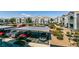 Apartment parking area with covered spots, well-maintained landscaping, and convenient waste disposal at 6955 N Durango Dr # 2081, Las Vegas, NV 89149