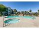 Resort-style pool area with a hot tub, waterfall feature, and lounge chairs at 6955 N Durango Dr # 2081, Las Vegas, NV 89149