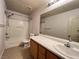 This bright bathroom has a tub-shower combo, a large mirror, and tile flooring at 7249 Old Glory St, Las Vegas, NV 89148
