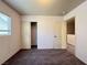 This bedroom offers neutral walls, plush carpeting, and a closet for ample storage at 7249 Old Glory St, Las Vegas, NV 89148