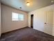Bedroom with carpet flooring, large window, and closet at 7249 Old Glory St, Las Vegas, NV 89148