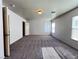 This spacious bedroom features neutral walls, plush carpeting, and plenty of natural light at 7249 Old Glory St, Las Vegas, NV 89148