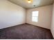 Bedroom featuring carpet flooring and a window for natural light at 7249 Old Glory St, Las Vegas, NV 89148
