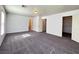 This spacious bedroom features neutral walls, plush carpeting, and multiple closets at 7249 Old Glory St, Las Vegas, NV 89148