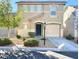Two-story home with desert landscaping, covered entry, attached garage and concrete driveway at 7249 Old Glory St, Las Vegas, NV 89148
