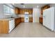 Bright kitchen features tile flooring, white appliances, and ample counter space at 7249 Old Glory St, Las Vegas, NV 89148