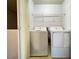 This laundry room features a washer, a dryer, and wire shelving at 7249 Old Glory St, Las Vegas, NV 89148