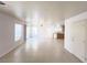 Spacious open-concept living room featuring tile flooring, recessed lighting, and backyard access at 7249 Old Glory St, Las Vegas, NV 89148