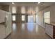 Open living space with tile floors, recessed lighting and backyard access at 7249 Old Glory St, Las Vegas, NV 89148
