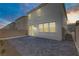Spacious brick patio is adjacent to the rear of the light-colored two-story home at 7256 Saxby Ave, Las Vegas, NV 89113