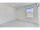 Bright bedroom features neutral carpet, white walls and trim, a window, and a closet at 7256 Saxby Ave, Las Vegas, NV 89113