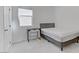 A well-lit bedroom is furnished with a double bed and desk and is carpeted at 7256 Saxby Ave, Las Vegas, NV 89113