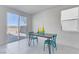 Bright dining area with stylish table, chairs, and sliding glass doors to the backyard for seamless indoor/outdoor living at 7256 Saxby Ave, Las Vegas, NV 89113