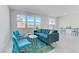 Bright living area featuring contemporary decor, large windows, and easy access to the dining space at 7256 Saxby Ave, Las Vegas, NV 89113