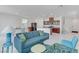 Open-concept layout with living room flowing into the kitchen, perfect for entertaining and modern living at 7256 Saxby Ave, Las Vegas, NV 89113