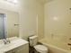 Clean bathroom featuring a bathtub, toilet, vanity sink, and a large mirror at 740 White Grotto St, Las Vegas, NV 89138