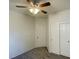 Neutral bedroom featuring carpet flooring, a ceiling fan, and sliding closet doors at 740 White Grotto St, Las Vegas, NV 89138