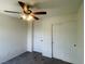 Bedroom with a fan, closet and ample storage with new carpet at 740 White Grotto St, Las Vegas, NV 89138