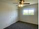 Bedroom with ceiling fan, closet and window overlooking a neighborhood at 740 White Grotto St, Las Vegas, NV 89138