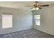 This bedroom features neutral walls, plush carpet and a ceiling fan at 740 White Grotto St, Las Vegas, NV 89138