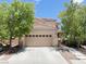 Charming two-story home featuring a two-car garage and mature landscaping at 740 White Grotto St, Las Vegas, NV 89138