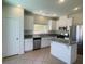 Well-lit kitchen featuring granite countertops, stainless steel appliances, and an island at 740 White Grotto St, Las Vegas, NV 89138