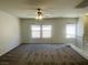A well-lit, spacious loft area features neutral walls, plush carpet, and several large windows at 740 White Grotto St, Las Vegas, NV 89138