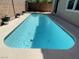 Backyard pool surrounded by a concrete patio, ready for summer fun and entertaining at 740 White Grotto St, Las Vegas, NV 89138