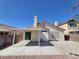 Home exterior with covered patio and desert landscaping; low maintenance and perfect for outdoor living at 7614 Isley Ave, Las Vegas, NV 89147