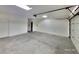 Bright garage featuring clean, concrete floors and automatic door opener at 7614 Isley Ave, Las Vegas, NV 89147
