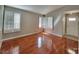 Bright living room with hardwood floors, plantation shutters, and an inviting front door at 7614 Isley Ave, Las Vegas, NV 89147