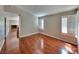 Bright living room with hardwood floors, modern shutters, and an open layout for easy entertaining at 7614 Isley Ave, Las Vegas, NV 89147