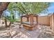 Relaxing backyard showcasing a charming wooden gazebo with comfortable seating at 7645 Falconwing Ave, Las Vegas, NV 89131