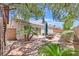 Cozy backyard patio with mature landscaping, perfect for entertaining and relaxing at 7645 Falconwing Ave, Las Vegas, NV 89131