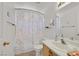 Clean bathroom with a shower-tub combo, neutral color scheme, and updated fixtures at 7645 Falconwing Ave, Las Vegas, NV 89131