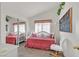 Bright bedroom featuring a daybed, mirrored closet, and stylish decor at 7645 Falconwing Ave, Las Vegas, NV 89131
