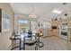 Inviting dining area with bright, natural light and neutral decor adjacent to the kitchen at 7645 Falconwing Ave, Las Vegas, NV 89131