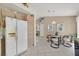 Efficient kitchen featuring bright cabinets and countertops, complemented by a connected dining area at 7645 Falconwing Ave, Las Vegas, NV 89131