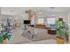 Large living space seamlessly connects to a dining area, boasting abundant natural light at 7645 Falconwing Ave, Las Vegas, NV 89131