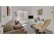 Comfortable living room with a sofa, recliner, and plenty of natural light at 7645 Falconwing Ave, Las Vegas, NV 89131