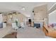 Spacious living area with fireplace, tile floors, vaulted ceilings, and plenty of natural light at 7645 Falconwing Ave, Las Vegas, NV 89131