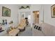 Cozy living room showcasing a mirrored closet, sofa, and comfortable lounge chair at 7645 Falconwing Ave, Las Vegas, NV 89131