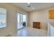 Bright dining area featuring tile floors, neutral walls, and a sliding glass door to the outdoor patio at 7649 Broadwing Dr, North Las Vegas, NV 89084